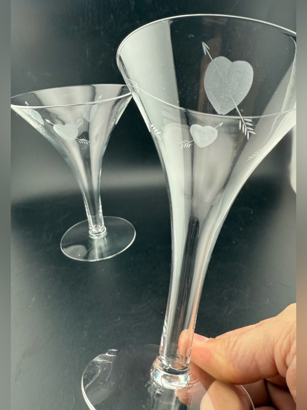 (2) Etched hearts w/arrows. Hollow stemmed champagne glasses.